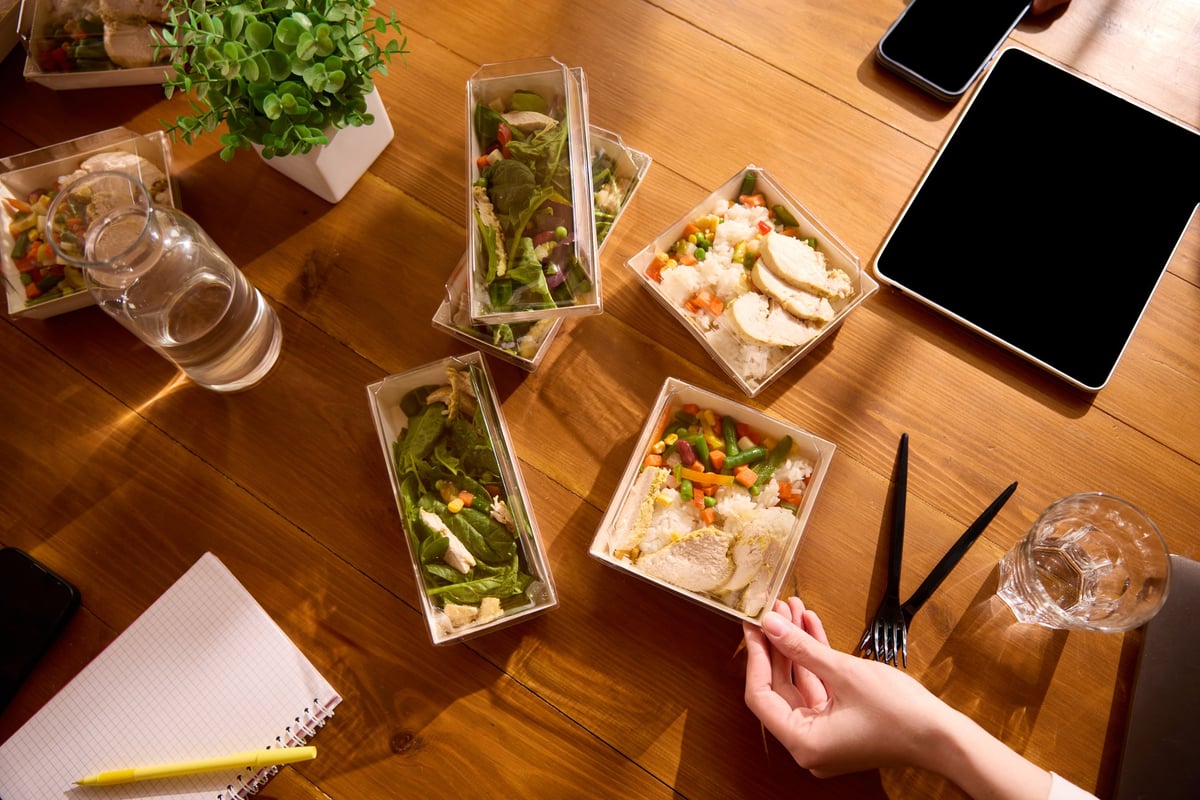 Ready-to-eat delivered meals laid out on a table